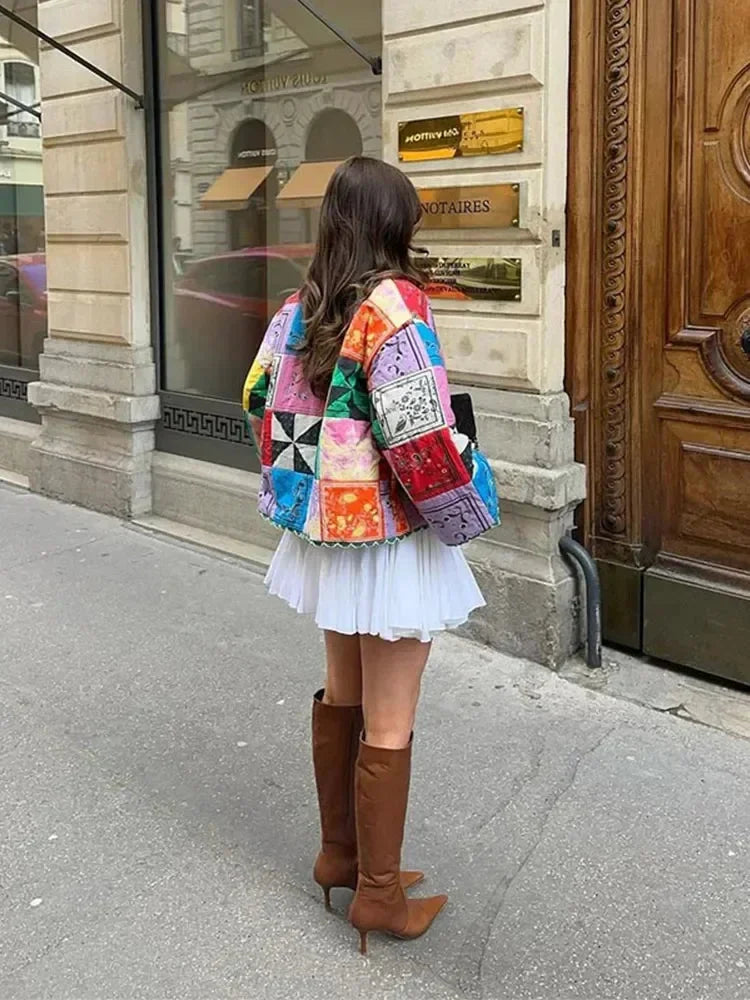 Colorful women's patchwork jacket featuring long sleeves, made from soft, durable fabric with a unique design.