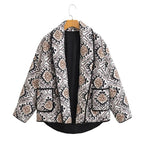 Women's patterned jacket with wide sleeves, made of soft cotton blend for comfort, featuring a colorful geometric design.