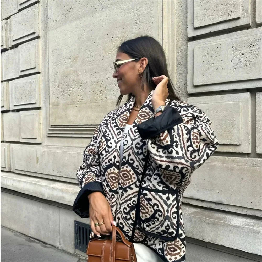 Women's patterned jacket with wide sleeves, featuring a lightweight fabric and colorful geometric designs for a stylish look.