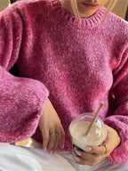 Women's pink backless pullover with long sleeves, crafted from soft cotton blend for comfort and unique open-back design.