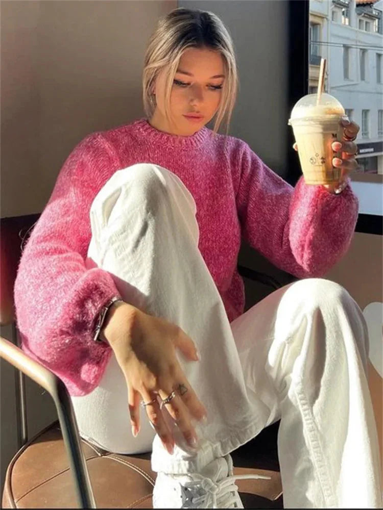 Women’s pink backless pullover with long sleeves, made from soft cotton blend, featuring a unique open-back design.