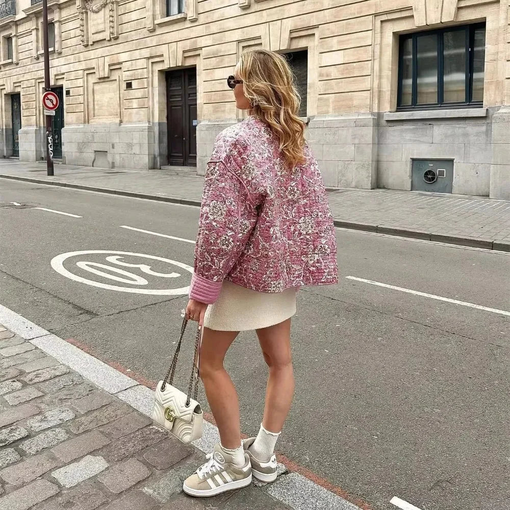 Women's pink boho floral jacket with long sleeves, made of breathable cotton with a relaxed fit and vibrant floral patterns.