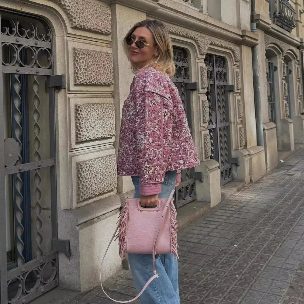 Women's pink boho floral jacket featuring long sleeves, made of lightweight fabric with vibrant floral patterns.