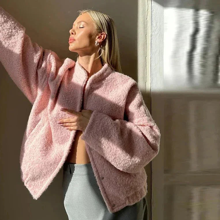 Women's pink oversized jacket featuring a soft, cozy texture and relaxed fit, perfect for layering in chilly weather.
