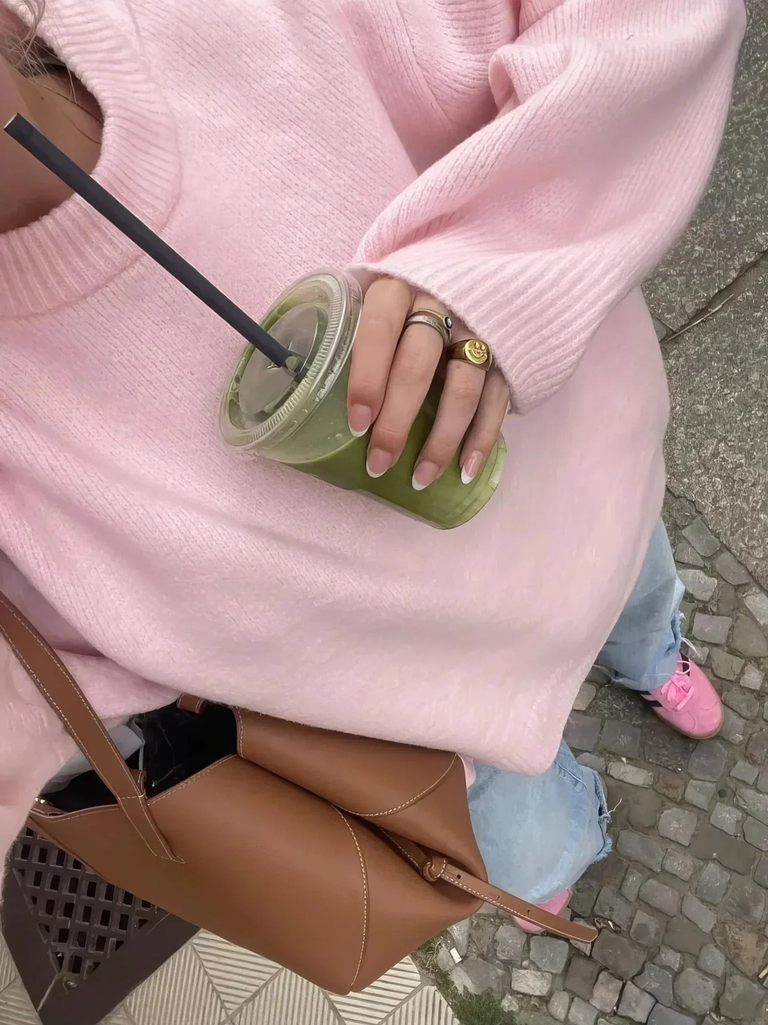 Women's pink pullover with round neck, long sleeves, made from soft cotton blend for comfort and everyday wear.