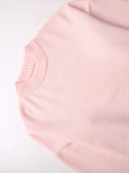 Women's pink round neck pullover made of soft cotton, featuring long sleeves and a relaxed fit for everyday comfort.