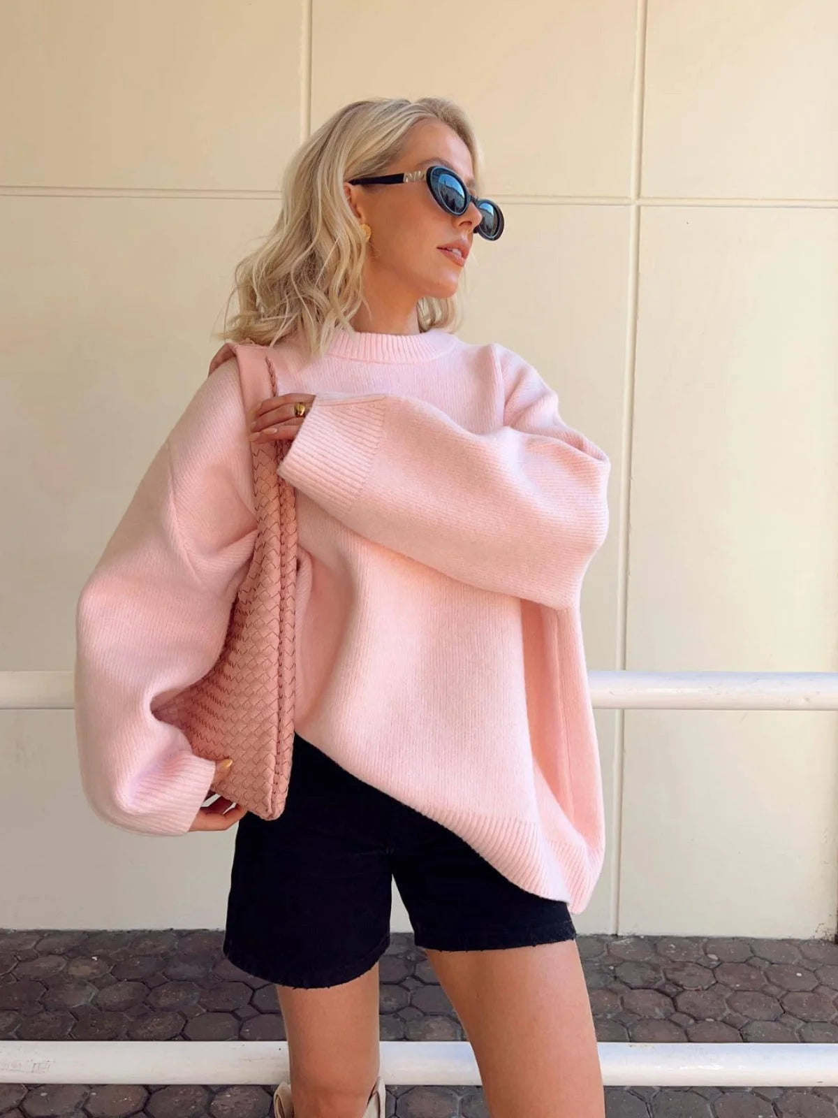 Women's pink round neck pullover, made of soft cotton, featuring long sleeves and a casual, comfortable fit.