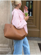 Women's pink round neck pullover with long sleeves, made of soft cotton blend for comfort and everyday wear.