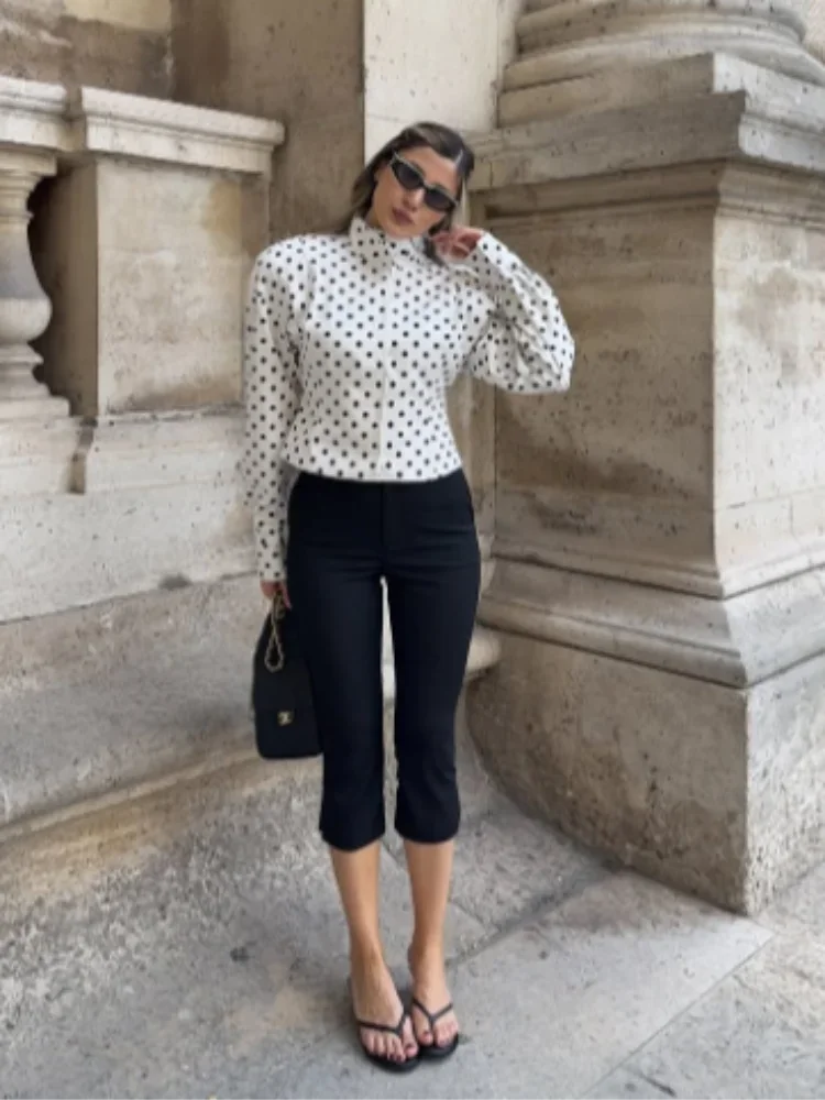 Women's long sleeve polka dot jacket with stand collar, made of lightweight fabric for casual wear.
