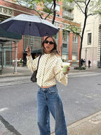 Women's long sleeve casual jacket featuring a polka dot pattern and stand neck design, made from soft, breathable fabric.