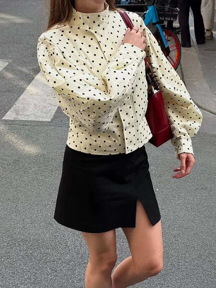 Women's polka dot jacket with stand neck, long sleeves, made from soft fabric, featuring a casual design for everyday wear.