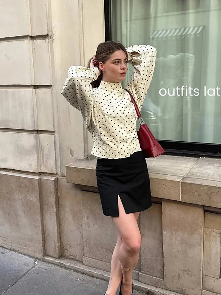Women's polka dot jacket with a stand neck and long sleeves, made from lightweight fabric for casual comfort and style.