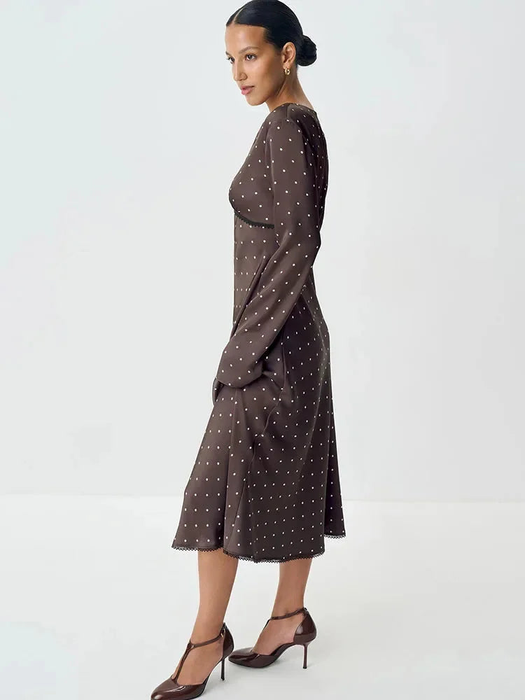 Women's polka dot V-neck maxi dress featuring lace details, made from soft fabric for comfort and style.