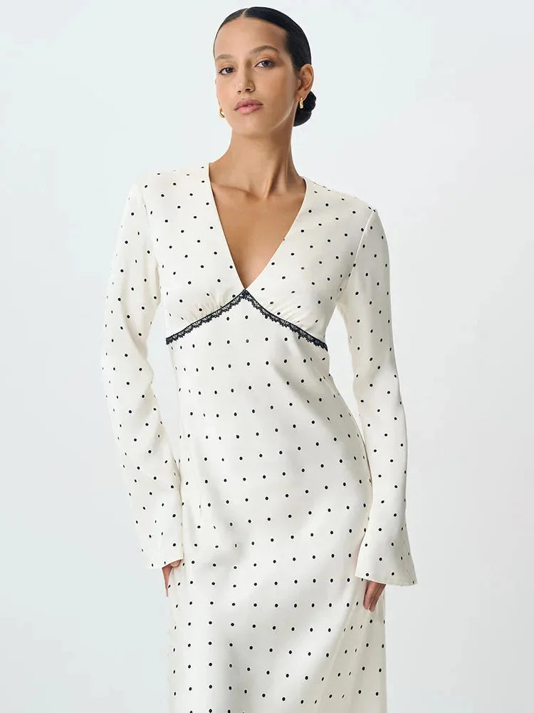 Women's polka dot V-neck maxi dress with lace details, featuring a flowy silhouette and lightweight fabric for comfort.