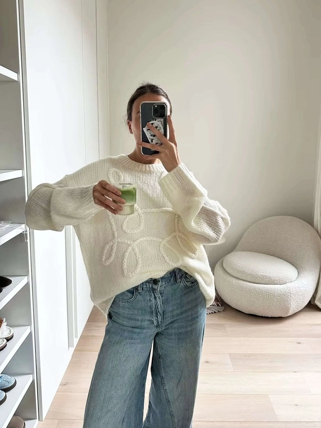 Women's pullover sweater featuring a cozy textured swirl design in soft knit material, perfect for layering in cooler…