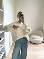 Women's pullover sweater featuring a cozy textured swirl design in soft knit material, perfect for layering in cooler…