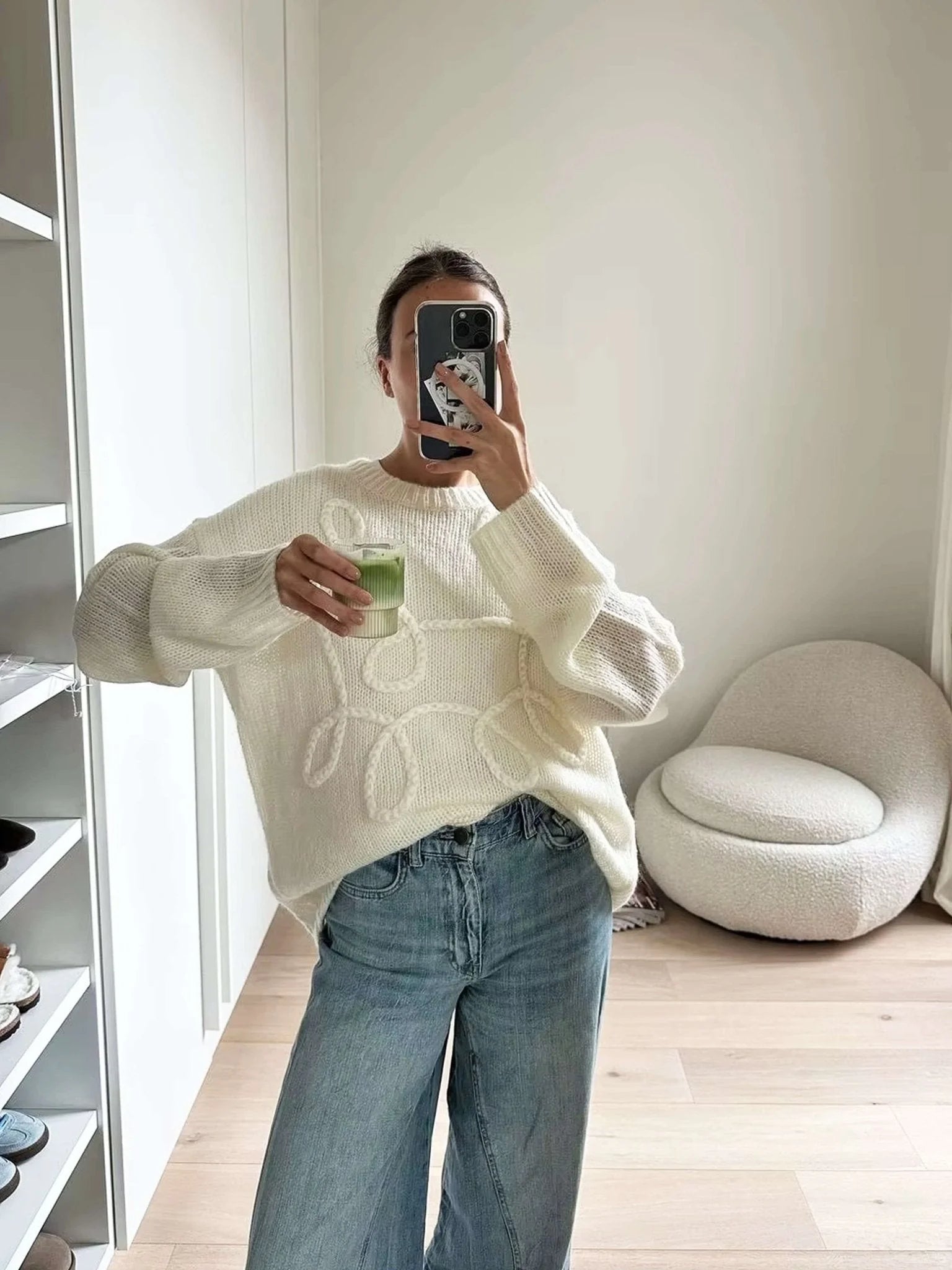 Women's pullover sweater featuring a cozy textured swirl design in soft knit material, perfect for layering in cooler…