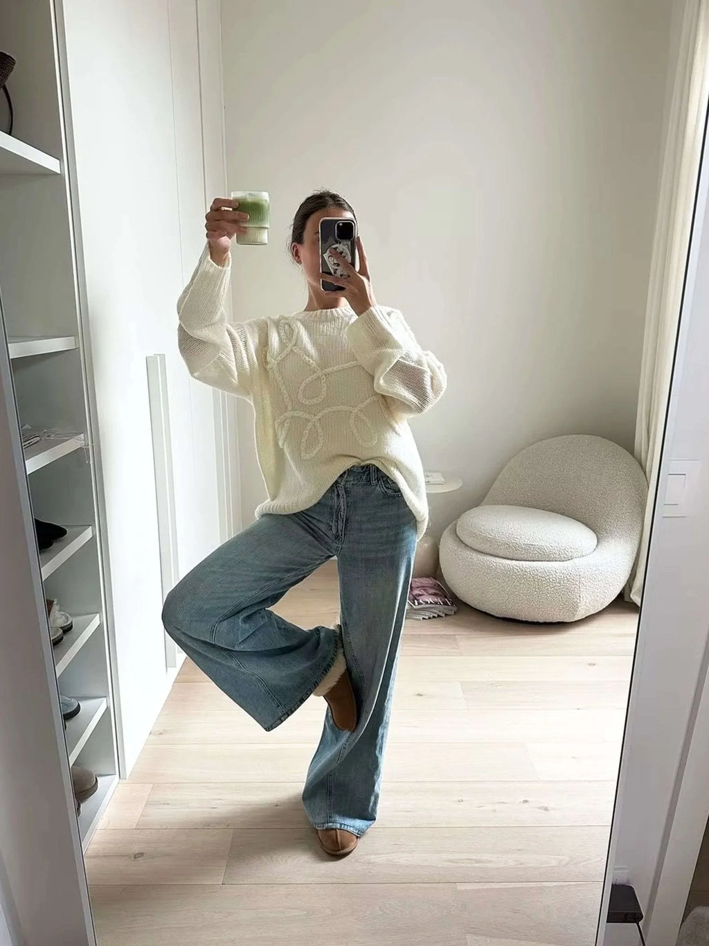 Cozy women's pullover sweater featuring a textured swirl design, made from soft knit fabric for warmth and comfort.