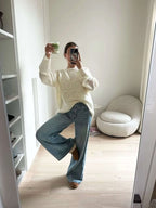 Cozy women's pullover sweater featuring a textured swirl design, made from soft knit fabric for warmth and comfort.