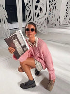 Women's pullover sweater featuring a textured swirl design, made from soft, cozy fabric for warmth and comfort.