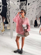 Women's pullover sweater featuring a textured swirl design, made from soft, breathable knit fabric for comfort and style.