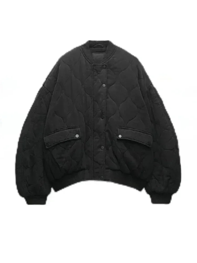 Women’s quilted bomber jacket with snap closures, featuring a warm polyester exterior and ribbed cuffs for a snug fit.