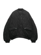 Women’s quilted bomber jacket with snap closures, featuring a warm polyester exterior and ribbed cuffs for a snug fit.
