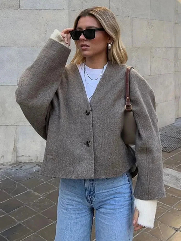 Women's relaxed button-up cardigan made of soft knit fabric featuring a cozy fit and classic design for everyday wear.