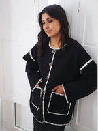 Women's relaxed fit cardigan made from soft cotton, featuring contrast stitching and an open front design for easy layering.