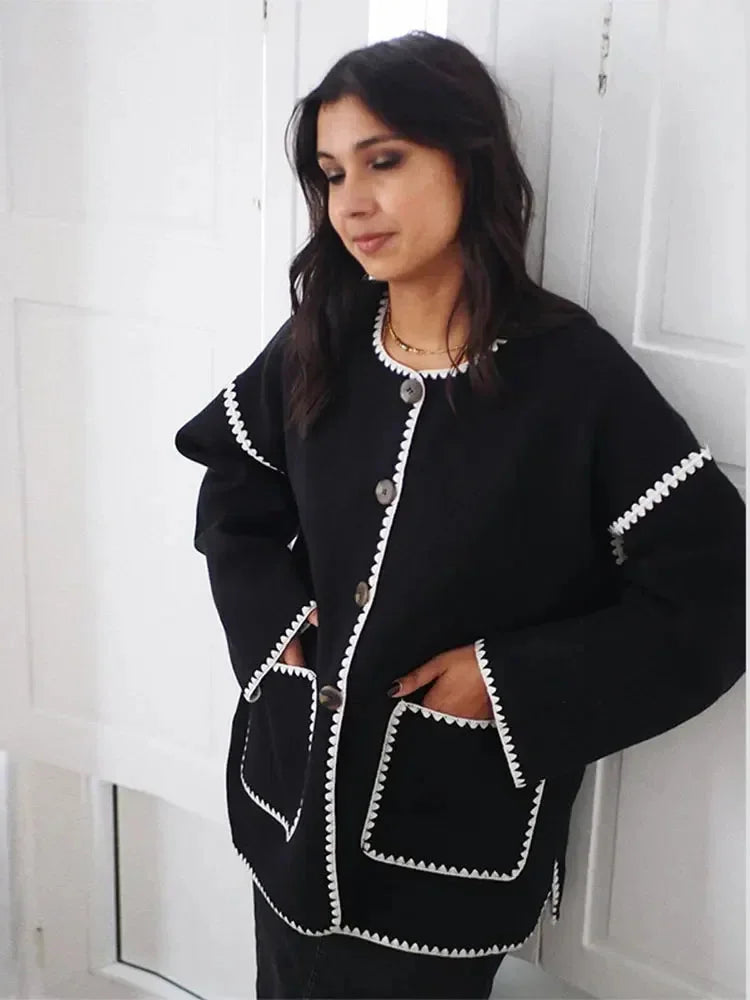 Women's relaxed fit cardigan made from soft cotton, featuring contrast stitching and an open front design for easy layering.