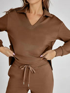 Women's relaxed fit long-sleeve top paired with wide-leg pants, crafted from soft cotton for comfort and casual style.
