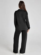 Women's relaxed fit long-sleeve top paired with wide-leg pants, made from soft, breathable cotton for casual comfort.