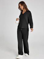 Women's relaxed fit long-sleeve top paired with wide-leg pants, made from soft, breathable cotton for everyday comfort.