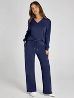 Women's relaxed fit long-sleeve top in soft cotton, paired with breathable wide-leg pants for easy, comfortable wear.