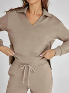 Women's relaxed fit long-sleeve top paired with wide-leg pants, made from soft cotton blend for comfort and everyday wear.