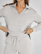 Women's relaxed fit long-sleeve top and wide-leg pants set, made of soft cotton blend, featuring a comfortable, casual…