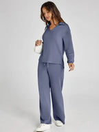 Lightweight cotton long-sleeve top with relaxed fit, paired with wide-leg pants for comfortable, casual wear.