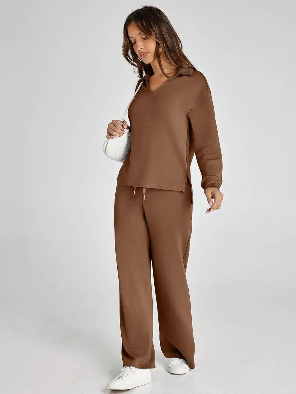 Women's relaxed fit long-sleeve top paired with wide-leg pants, made from soft cotton blend for comfortable wear.