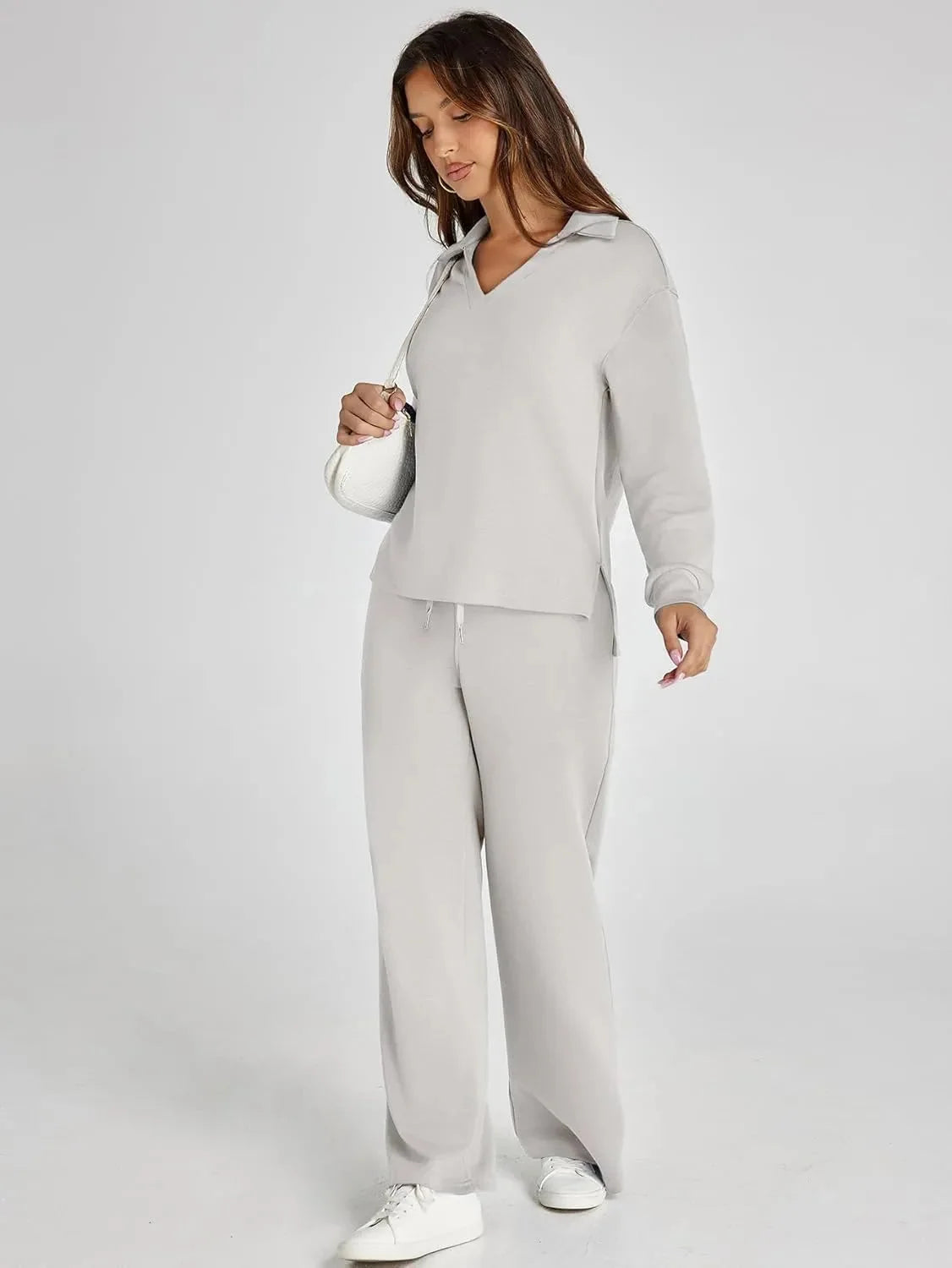Women's relaxed fit long-sleeve top paired with wide-leg pants, made from soft cotton blend for comfort and ease of movement.