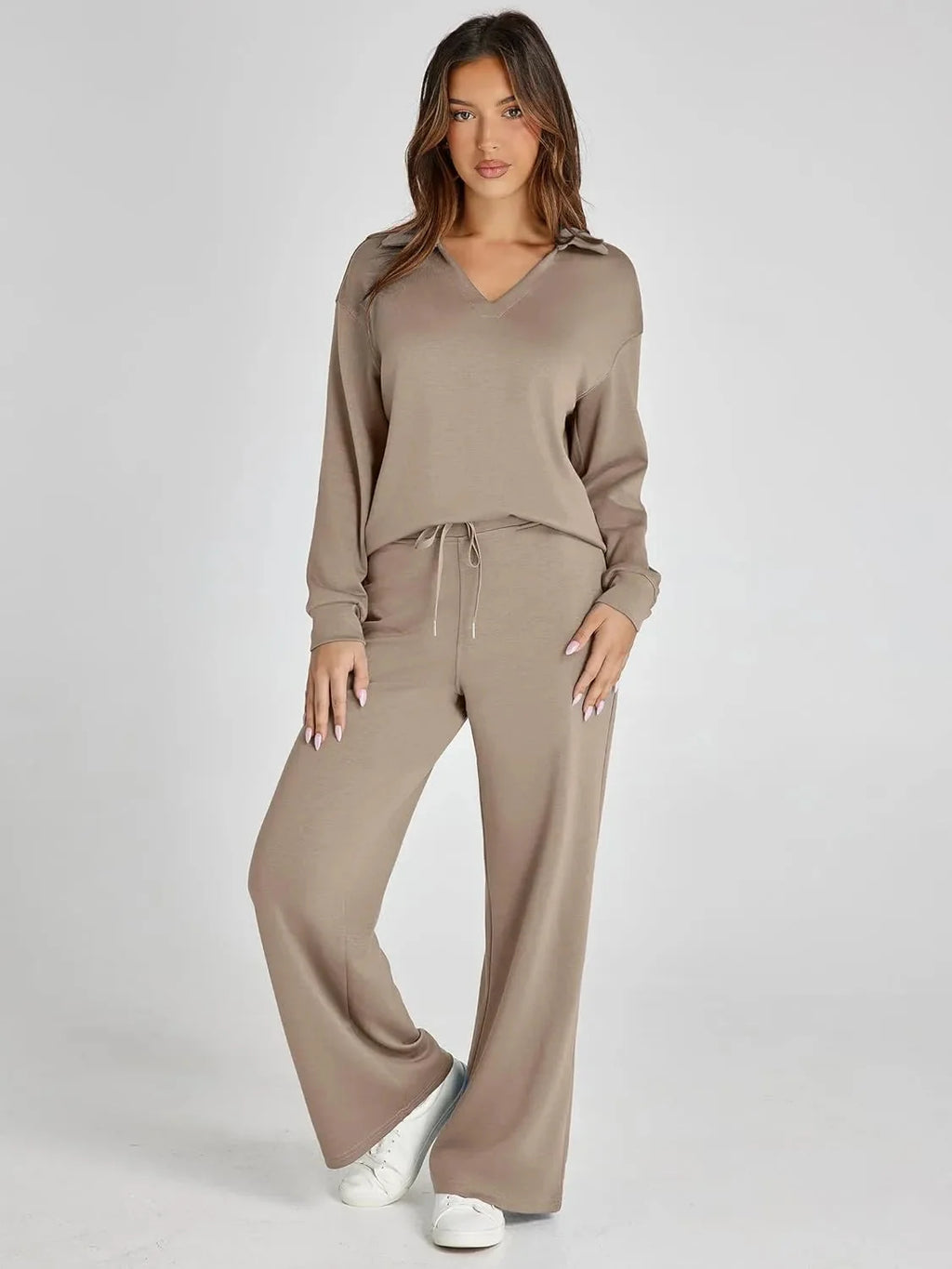 Women's relaxed fit long-sleeve top and wide-leg pants set, made from soft cotton blend for comfort and ease of movement.
