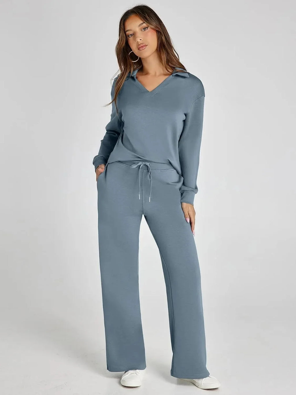 Women's relaxed-fit long-sleeve top in soft cotton paired with wide-leg pants, featuring a comfortable and casual design.