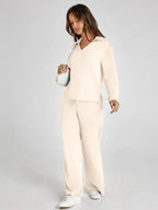 Women's relaxed fit long-sleeve top and wide-leg pants set, made from soft cotton blend with a comfortable, casual design.
