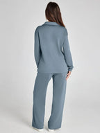 Women's relaxed fit long-sleeve top made of soft cotton, paired with wide-leg pants for a comfortable, casual look.