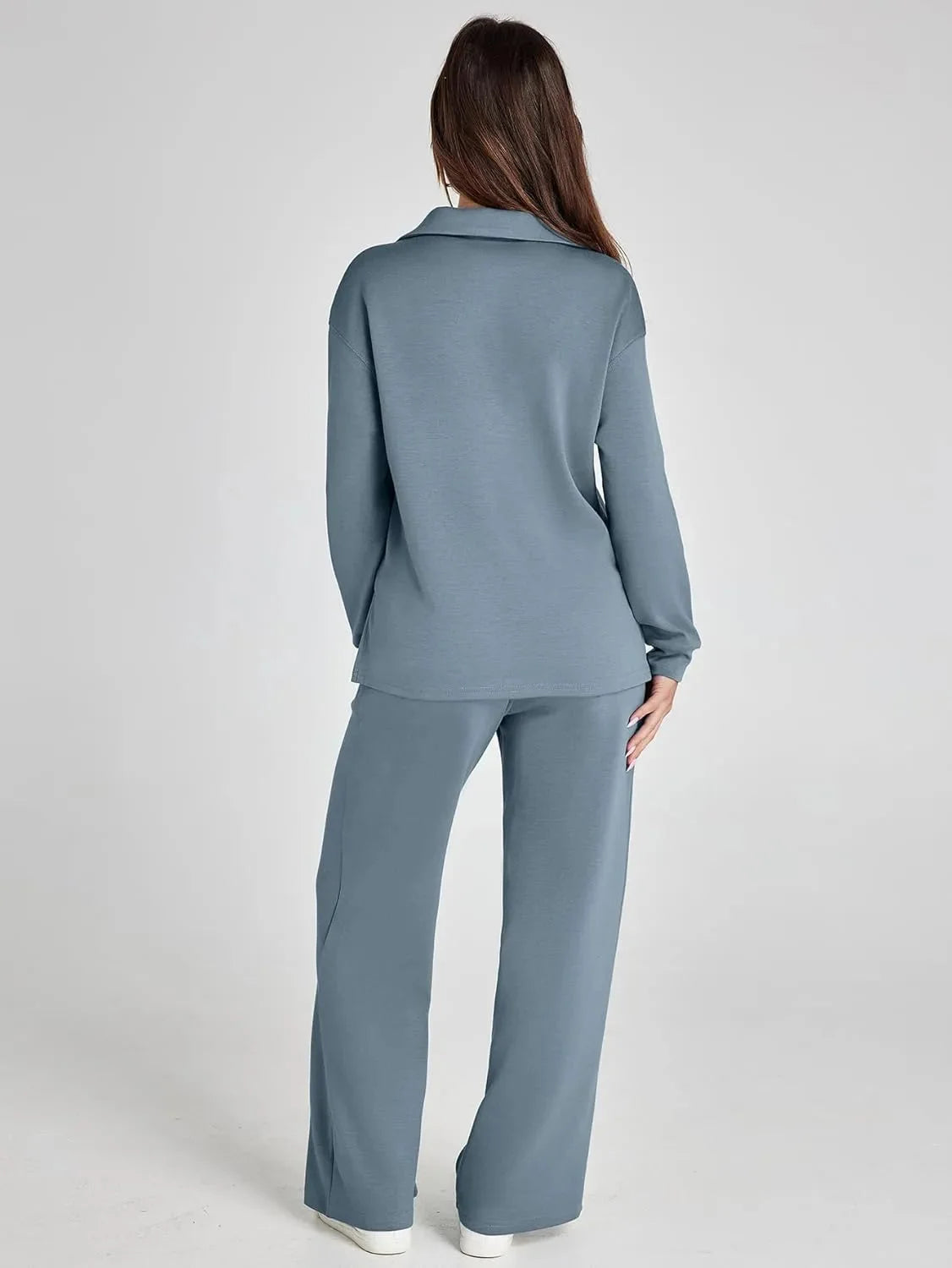 Women's relaxed fit long-sleeve top made of soft cotton, paired with wide-leg pants for a comfortable, casual look.