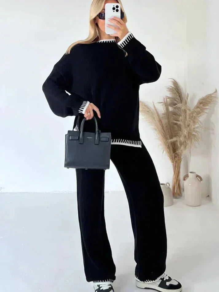 Women's relaxed fit sweater and pants set, made of soft cotton blend, featuring a comfortable silhouette and casual design.