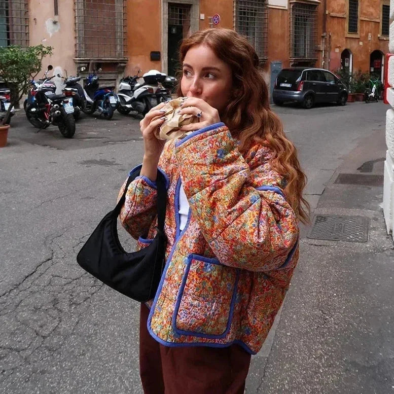 Women's retro boho quilted jacket made of soft fabric featuring a bold print and cozy, warm padding for comfort.