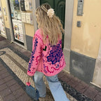 Women's retro boho quilted jacket featuring a colorful patchwork design and soft cotton material for comfort and warmth.