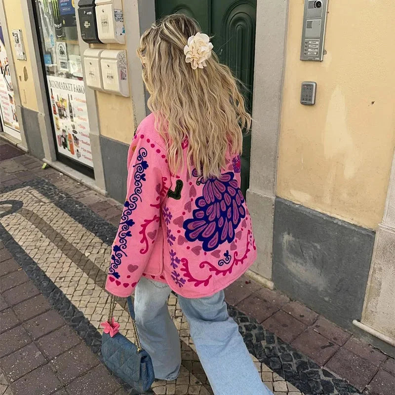 Women's retro boho quilted jacket featuring a colorful patchwork design and soft cotton material for comfort and warmth.