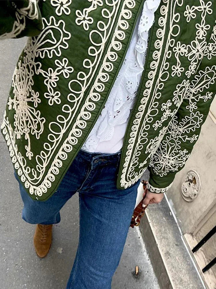 Women's retro boho style quilted jacket with a cozy, patterned fabric and contrasting trim, perfect for cool weather…