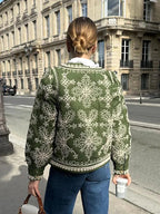 Women's retro boho quilted jacket in soft fabric, featuring a colorful patchwork design and functional front pockets.